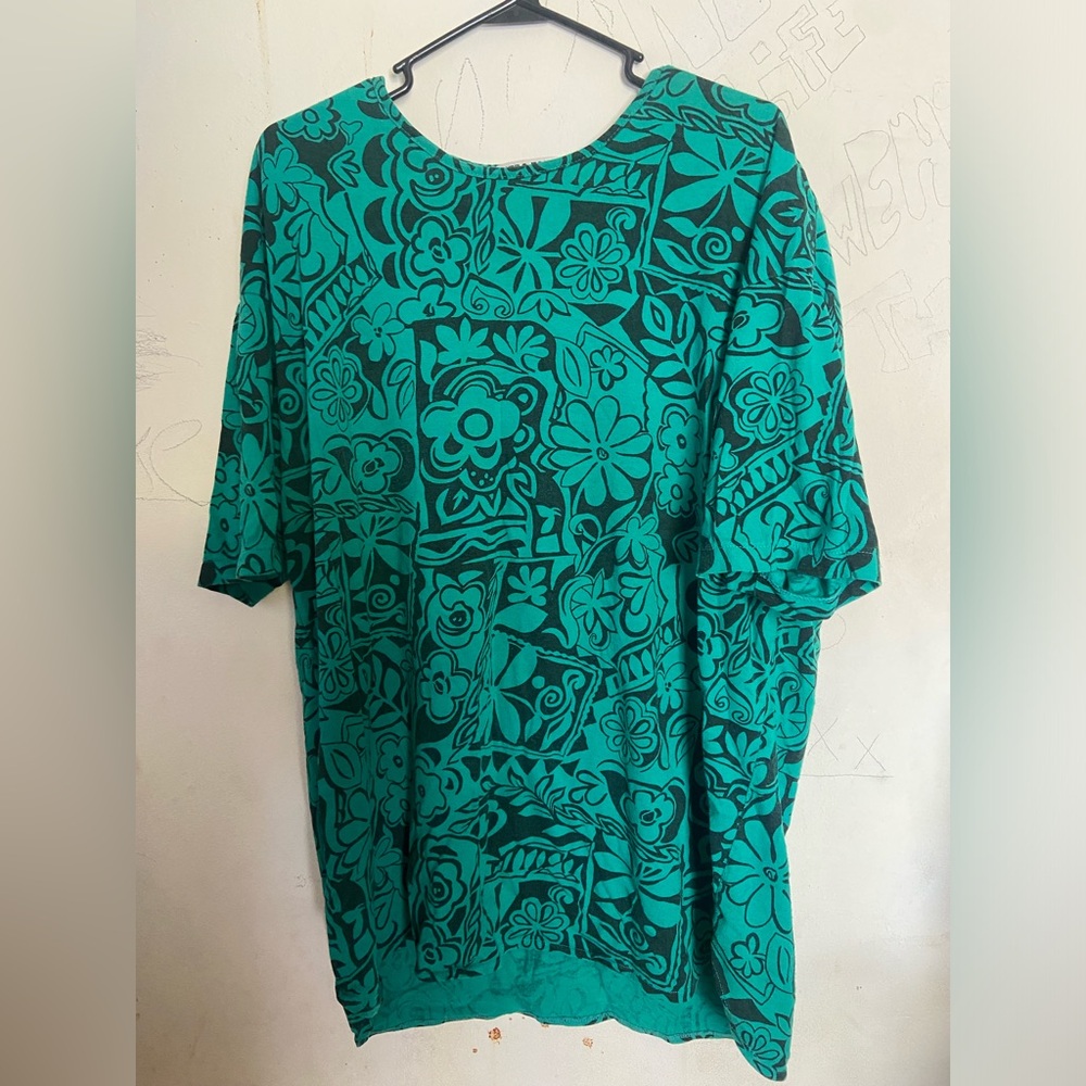 Floral green shirt with removable shoulder pads. Fits like a 2x.
